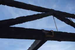 Blackened roof beams in the burned out laundry building [fri feb 12 10:44:42 pst 2016]